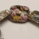 Focal bead of floral bracelet